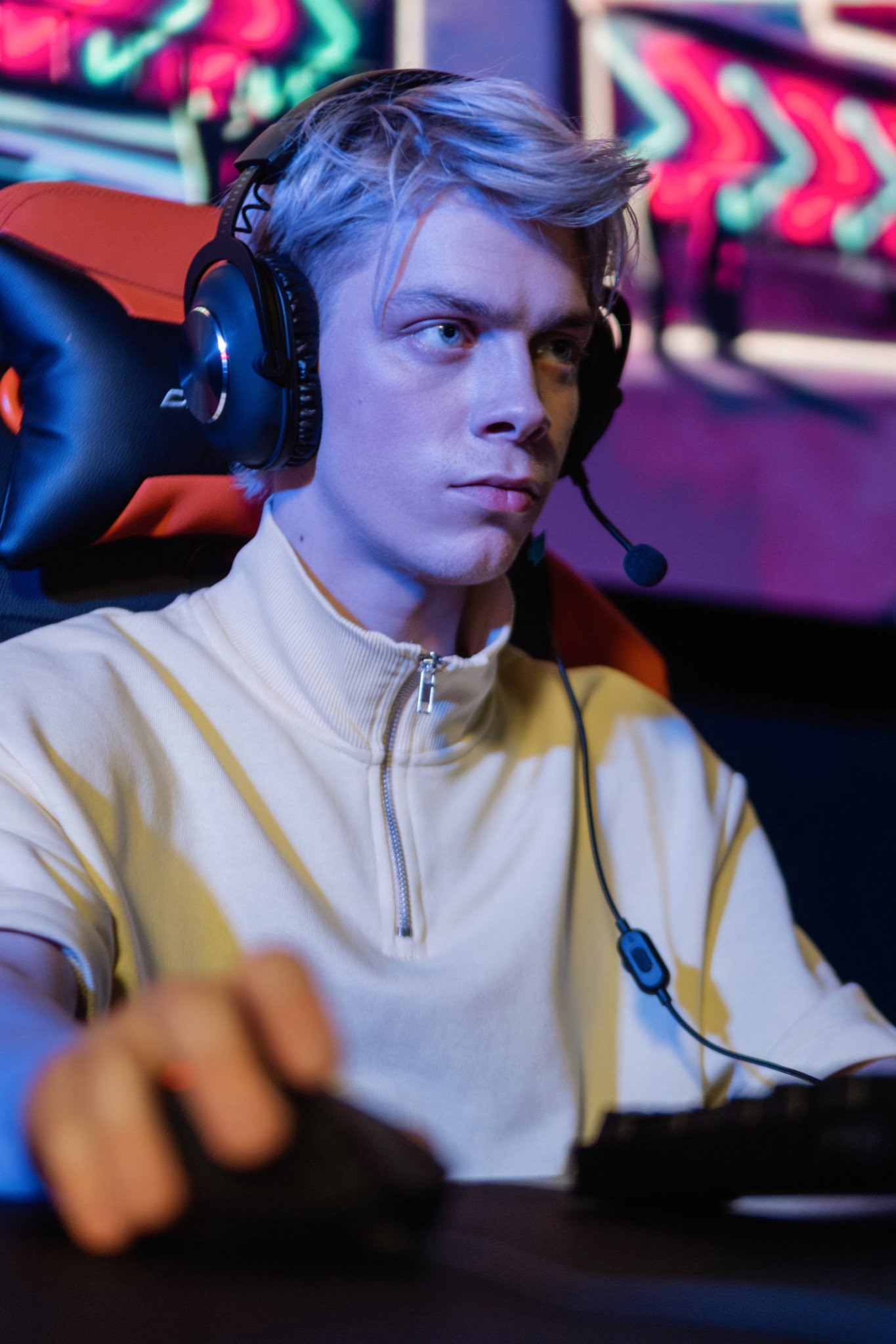 a man in yellow jacket wearing gaming headset